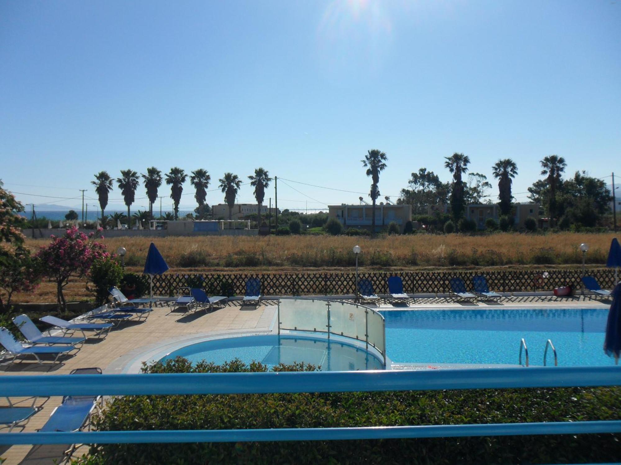 Miros Hotel Apartments Тигаки Экстерьер фото